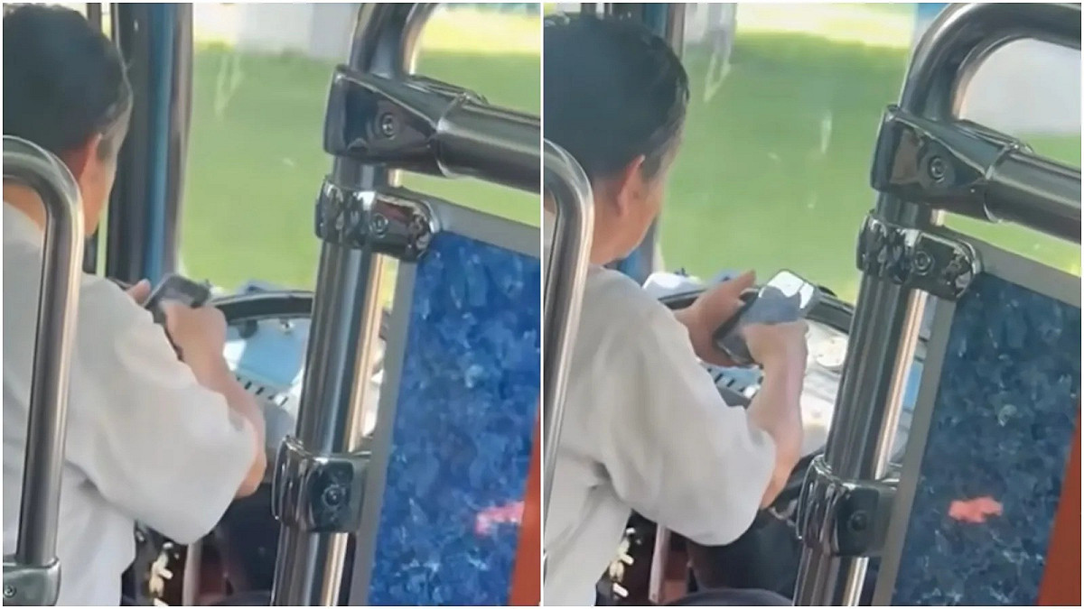 客運司機邊開車邊滑手機，並且以手肘操控方向盤。 圖：翻攝自爆料公社