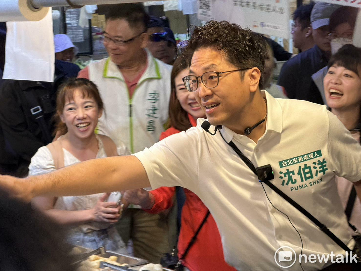 沈伯洋到西湖市場拜票。 圖：高逸帆／攝