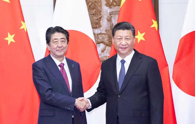 日本首相安倍晉三日前會見中國主席習近平。 圖：翻攝微博