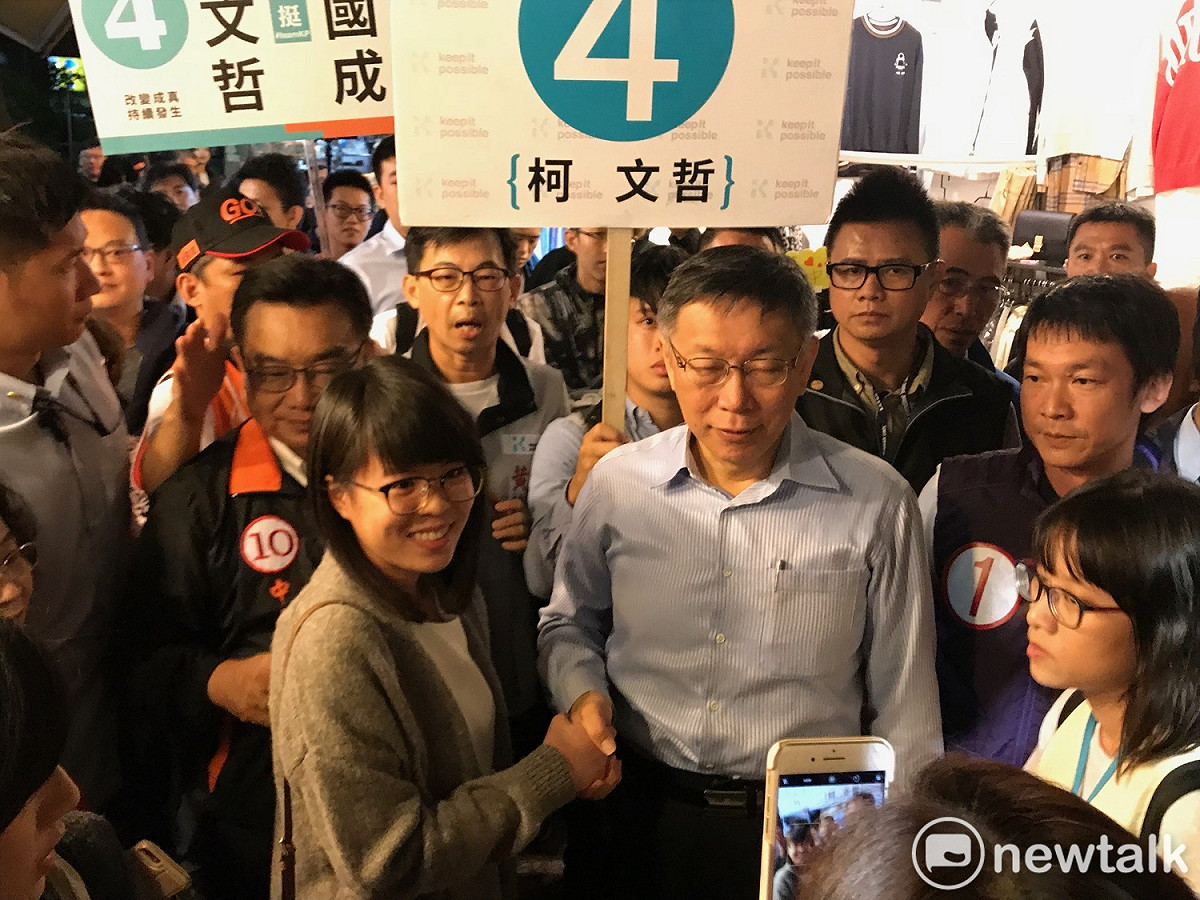 柯文哲晴光市場掃街，人氣依舊高。 圖 : 周煊惠 / 攝
