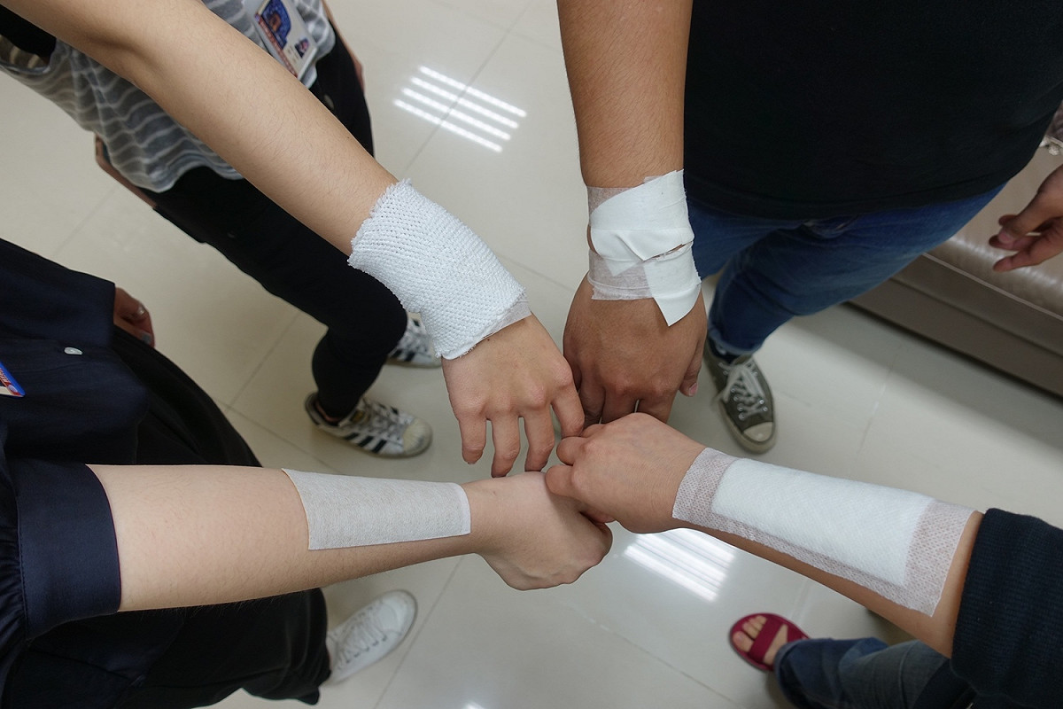 僅15位的稅務類驗證人力中，因近年稅務驗證量持續增加，已經有幾位出現手腕肩膀發炎等「職業災害」。 圖：海基會提供