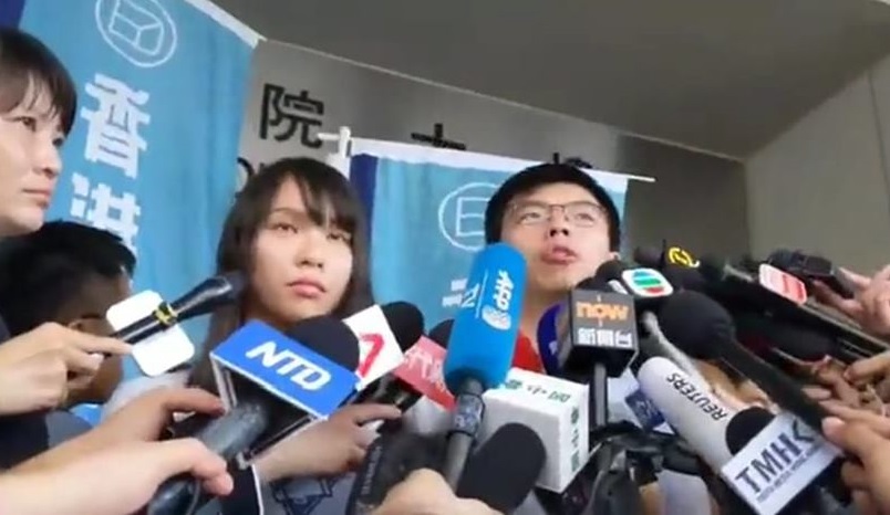 香港眾志祕書長黃之鋒今（30）日下午獲東區裁判法院裁准交保後表示，堅持「反送中」5大訴求，永遠不會投降。 圖：翻攝Youtube
