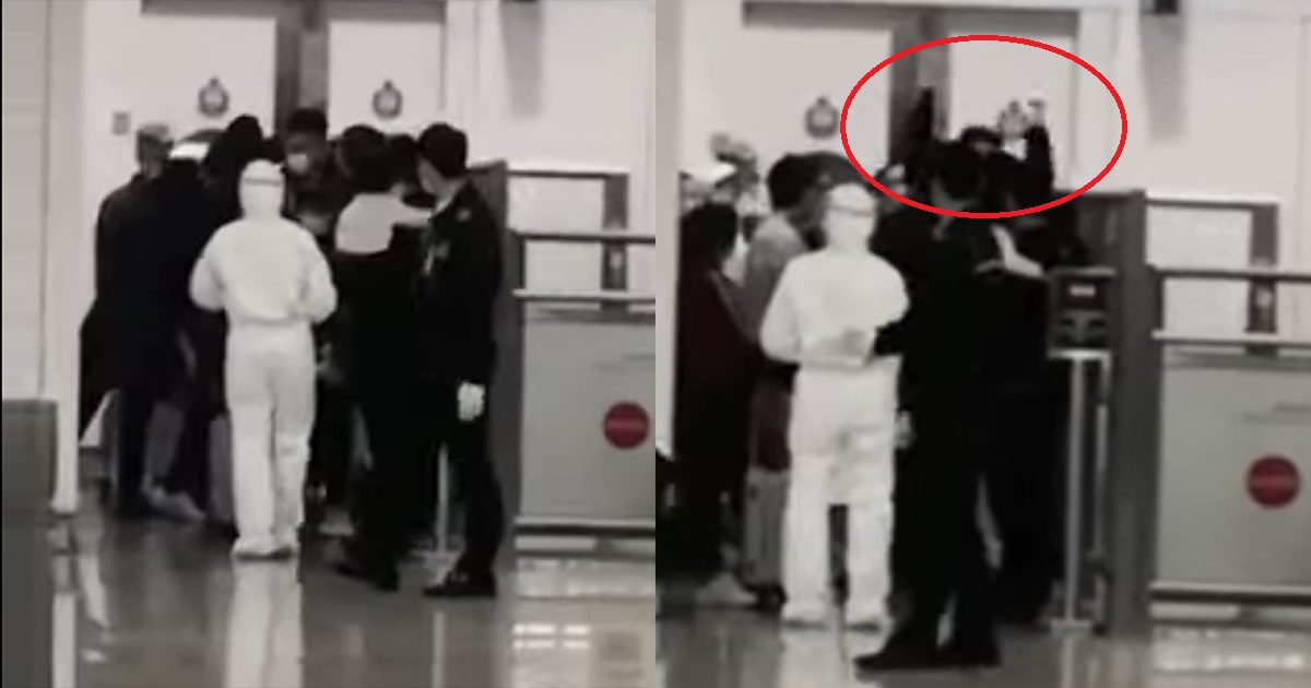 網路影片指有湖北人在香港機場入境被拒，其中一名男子顯得相當激動，舉起雙手高喊。 圖：翻攝絕緣王臉書