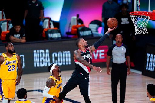Damian Lillard所效力的拓荒者在季後賽首輪遭LeBron James領軍的湖人遭淘汰。 圖／美聯社／達志影像