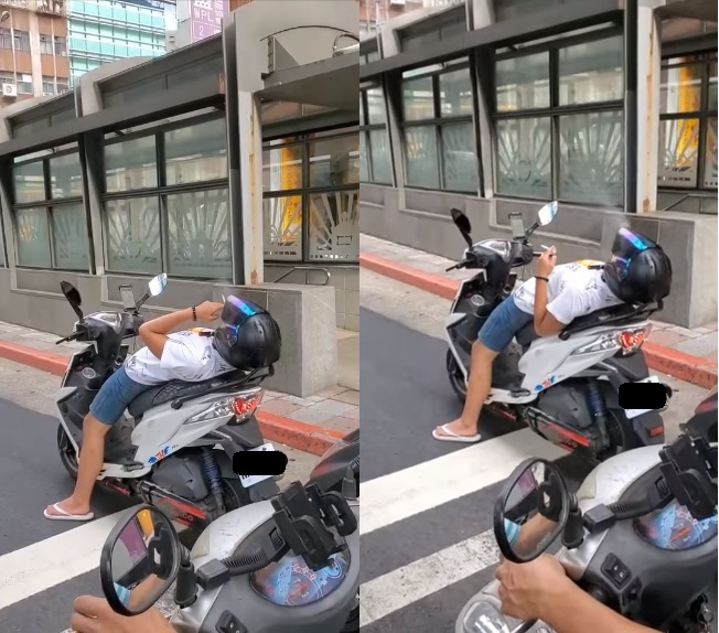 男騎士，在等紅燈時不僅越線，竟然直接向後仰躺在機車坐墊上，還點了一根菸開始吞雲吐霧。 圖：翻攝自路上觀察學院