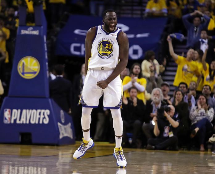 誓言今拿下灰熊，Draymond Green要隊友戴好安全帽。 圖／美聯社／達志影像