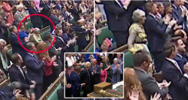 英國首相強生20日在國會中進行最後一次應詢，其中英媒發現，在強生結束演說後，全場起身鼓掌，前首相梅伊卻拒絕鼓掌，怒容滿面。 圖：翻攝自環球網