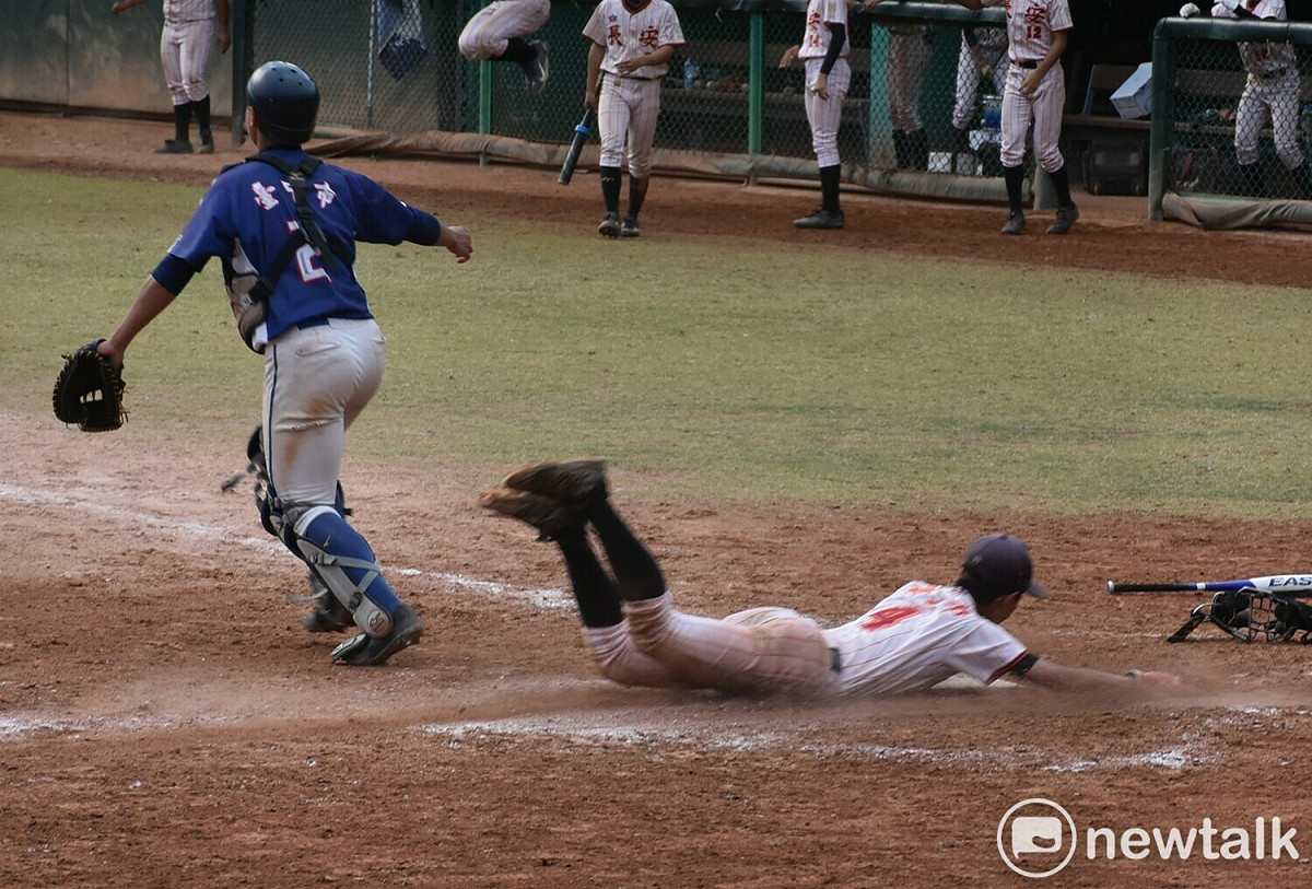 台北長安在延長以滑壘拿下致勝分。  圖：孫家銘攝