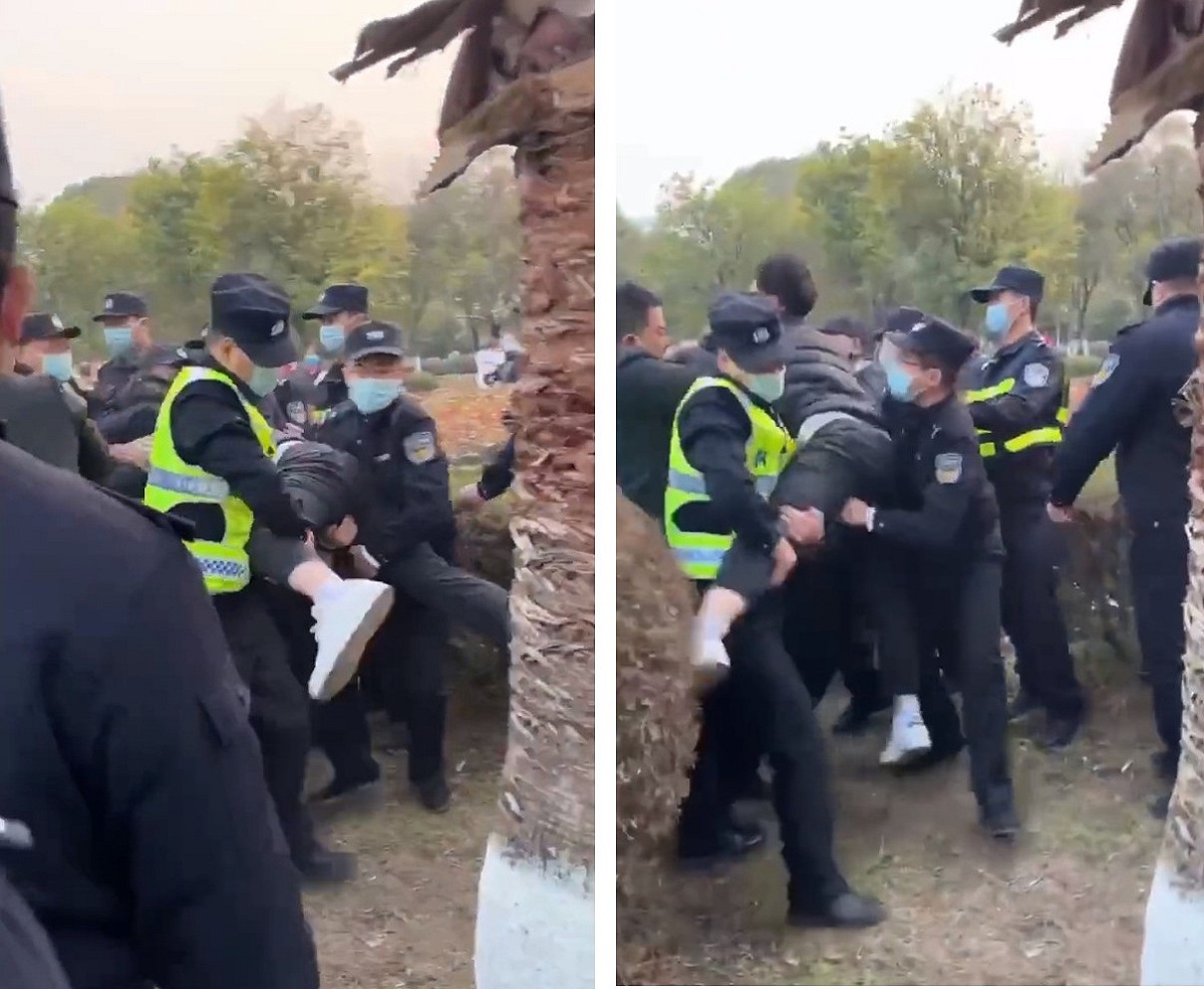 一名抗議男子被 4 、5 名身穿螢光值勤背心的警察強壓在地，隨後被更多警察攔腰抱起、當場拖走。 圖:翻攝自推特/李老师不是你老师 (@whyyoutouzhele)