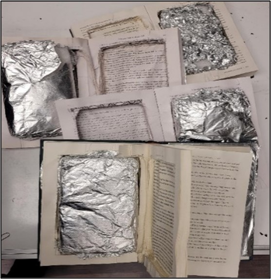 在俄勒岡州查獲的鏤空書籍中發現約兩公斤的冰毒，目的地為澳洲。 圖 : 翻攝自X帳號 @USAO_LosAngeles