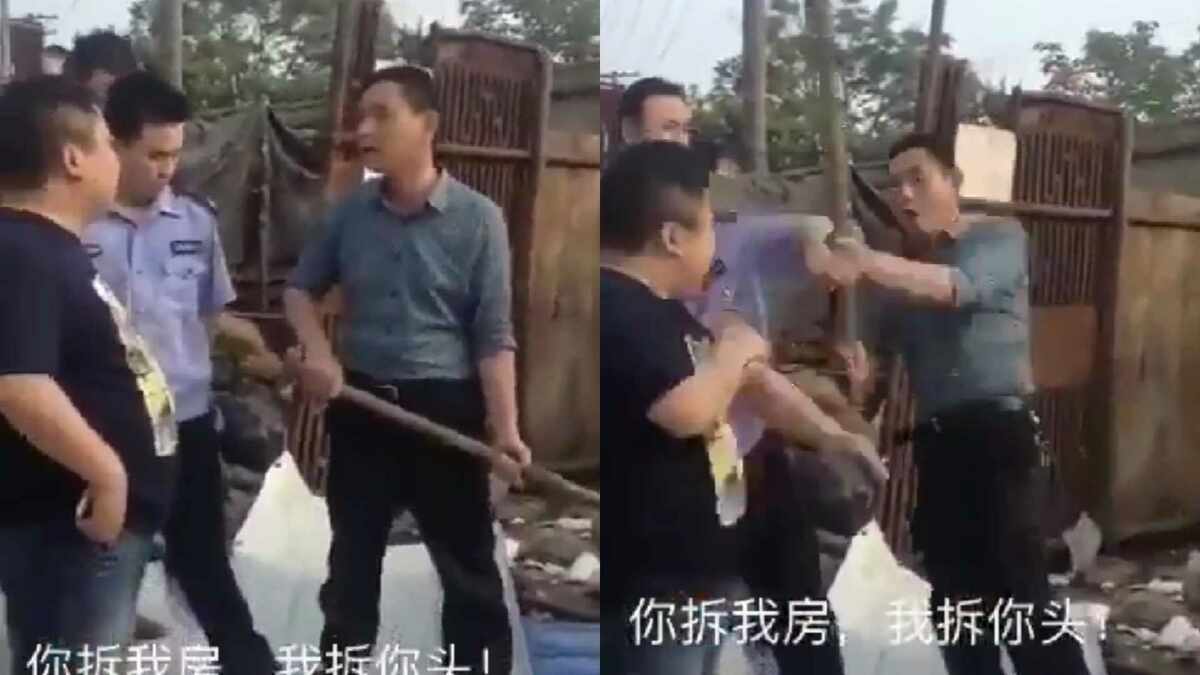 一名男子疑似因不滿拆遷行動，情緒激動下持鐵鍬襲擊拆遷人員。 圖:翻攝自影片