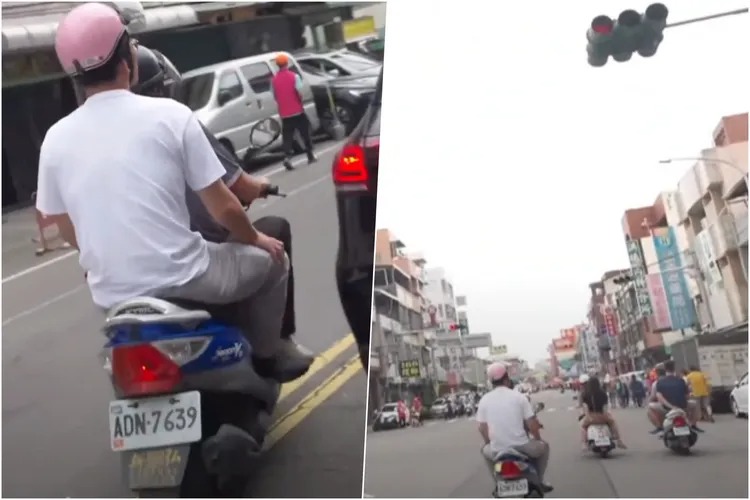 黃國昌乘坐的機車違規跨越雙黃線、逆向，還闖紅燈。 圖：翻攝自民眾黨YouTube直播
