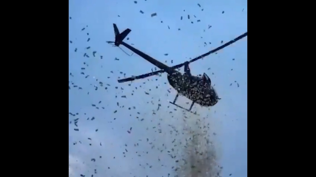 美國底特律的上空近期突然下起「鈔票雨」，吸引當地民眾前往撿拾，相關事件也引起世界各地網友關注。 圖：擷取自 @nexta_tv X 分享影片