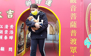 新北動保處與板橋接雲寺合作  全國首創為毛寶貝點光明燈