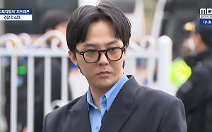 GD爆染毒後首露面！坦然現身警局喊話粉絲：不要太擔心