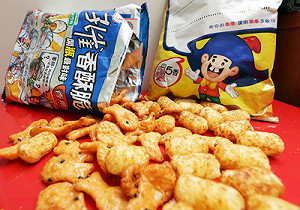 頂新飼料油  孔雀香酥脆、五香乖乖再中鏢