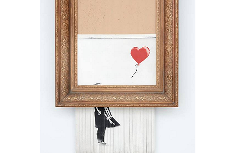 (影) 班克西自毀畫 仍以高額104萬英鎊賣出