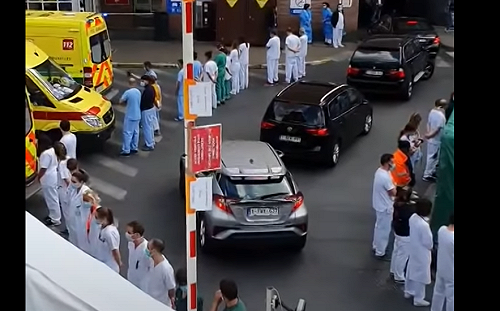 「背對」夾道歡迎總理   比利時醫護人員展現無聲抗議