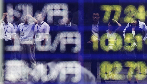 日本實施貨幣寬鬆政策  梅克爾擔憂