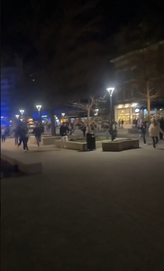  愛荷華大學旁的步行街區傳出槍響，引發周圍民眾驚慌逃竄。 圖:翻攝自 X @nexta_tv 