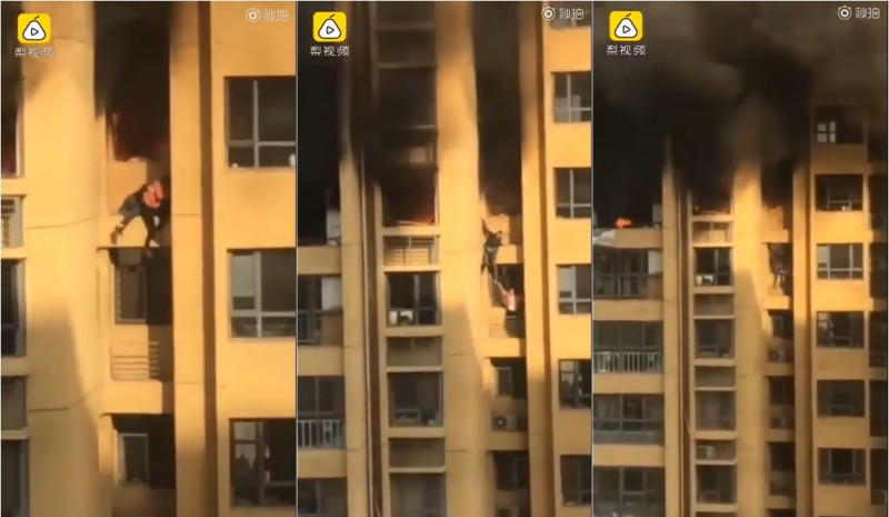 青島高樓發生大火，一對男女從25樓往下爬求生。   圖：翻攝自《梨視頻》秒拍