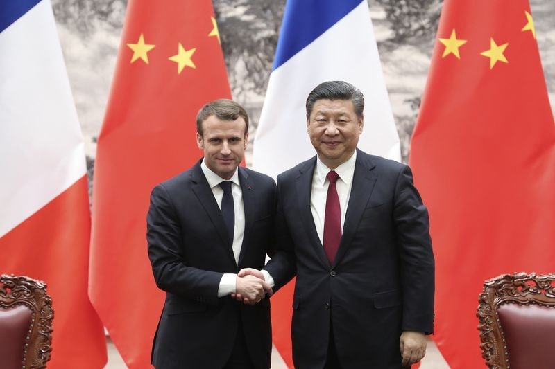 圖為中國國家主席習近平（右起）與法國總統馬克宏2018年1月在北京舉行會談。（檔案照片／中新社提供）   