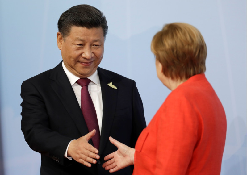 中德領導人過去會面時握手致意   圖:達志影像/美聯社