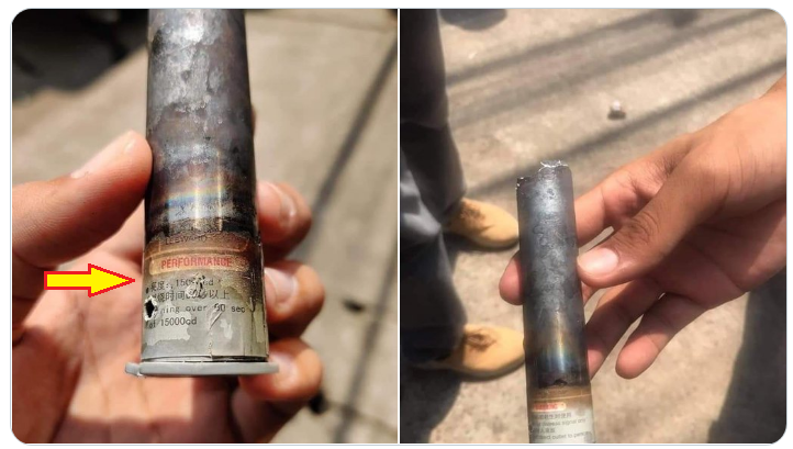 緬甸抗議民眾2日在仰光三橋區的激烈抗爭中，撿到1枚由軍方發射的催淚瓦斯彈，赫然看到彈殼上的簡體中文（箭頭處）。   圖：翻攝自Keren Khin推特