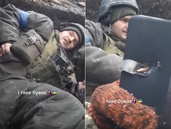 Reddit流傳一部影片，一名烏克蘭士兵拿出手機，一顆子彈竟卡在手機內，士兵撿回一命。   圖:Reddit