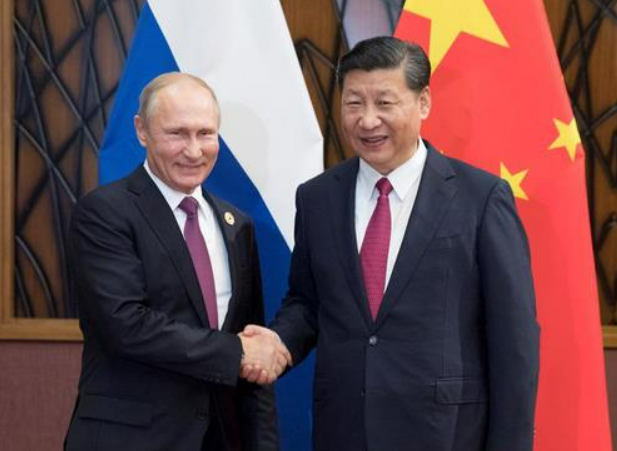 中俄關係緊密，圖左為俄羅斯總統普丁，圖右為中國國家主席習近平。   圖 : 翻攝自中新網
