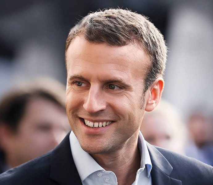 聲勢看漲的法國總統候選人馬克宏被媒體踢爆，在經濟部長任內，參加了一場未經招標就指定主辦單位的活動，當中可能有人徇私。   圖：翻攝Emmanuel Macron臉書