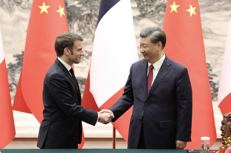 法國總統馬克宏（左）訪問中國與中國國家主席習近平（右）會面。   圖：翻攝中新社