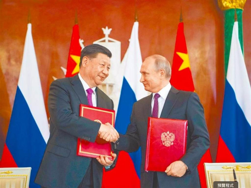 中國國家主席習近平（左）不惜毀掉中國國際聲譽也要力挺他的好朋友普丁（右）。   圖：翻攝新華社