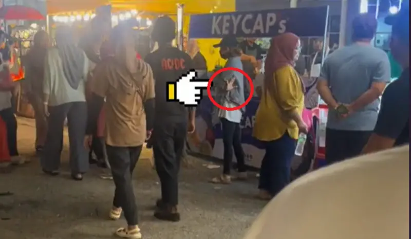 日前在馬來西亞有民眾在逛夜市時，目睹一對情侶逛街，但走在後方的女子還不斷比出「540」手勢，讓他立刻察覺事有蹊蹺。   圖：TikTok＠hazrulhaliliceokaw