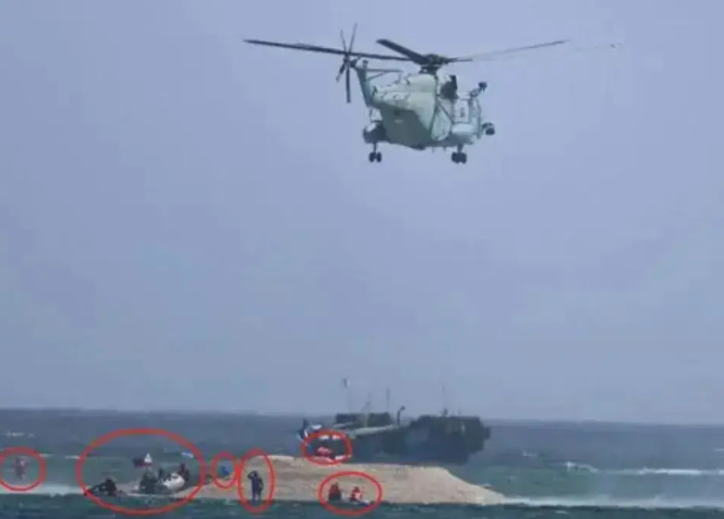 菲律賓人員登上鐵線礁。   圖:翻攝自軍武次位面