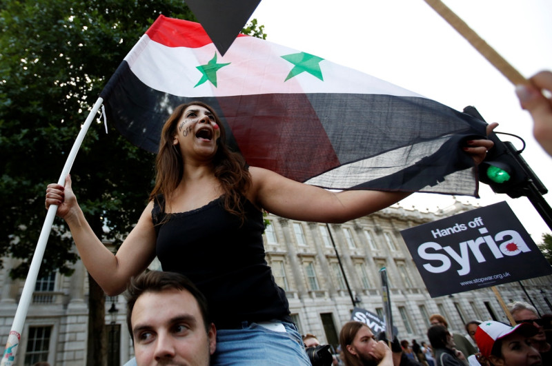 圖為28日英倫民眾上街示威抗議，反對英政府打算軍事干預敘利亞。圖片來源：達志影像/路透社。   