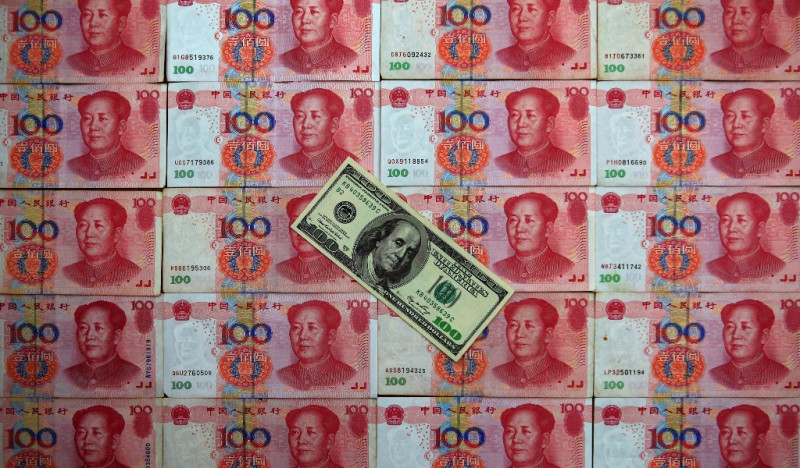 中國人行周三（9日）將人民幣中間價訂於1美元兌人民幣6.414元，為2011年8月份以來〈4年多來〉的最低價位。圖片來源：達志影像/路透社   