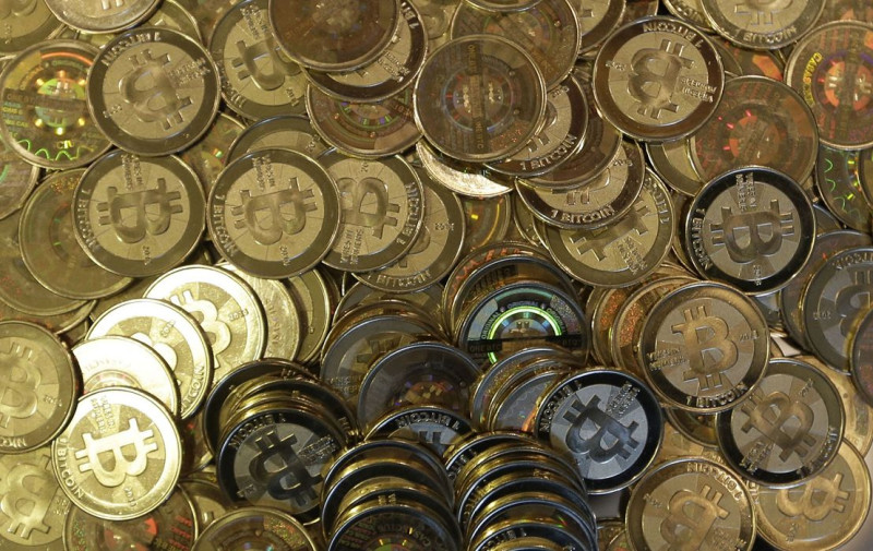 日本政府7日在內閣會議上確定，虛擬貨幣比特幣（Bitcoin）不是貨幣，而是商品。圖片來源：達志影像/美聯社資料照片   